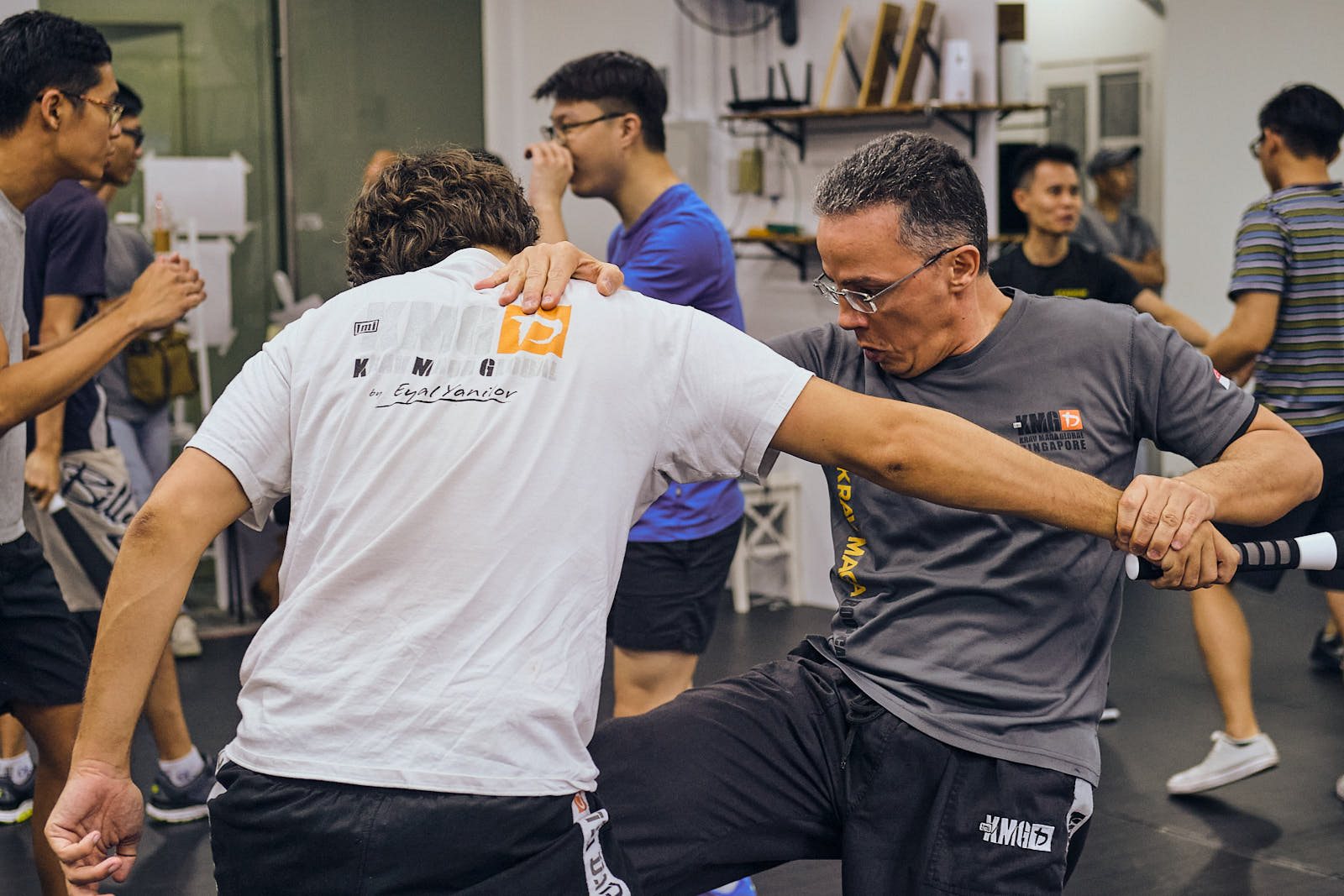 Adult student training stick defence at Kravist